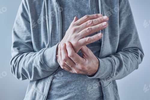 Preview: Rheumatoid arthritis, man suffering from severe pain in wrist