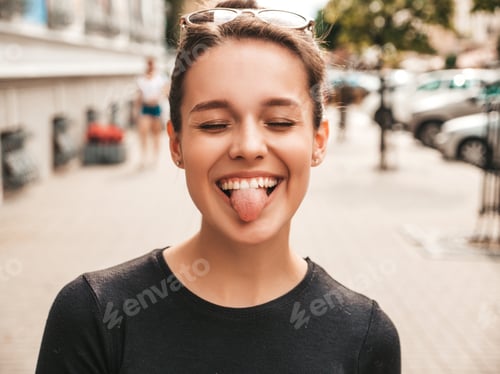 Preview: Portrait of young funny woman posing outdoors