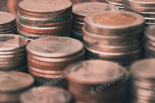 Preview: Piles of stacked coins with a blurred background, the concept of savings and investment