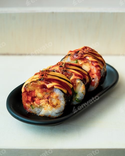 Preview: Korean food, gimbap or kimbap in a plate on a wooden background.