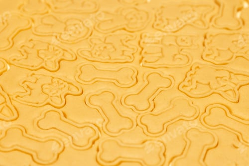 Preview: The pattern on the raw dough. Carved cookie shapes in the shape of bones and dogs