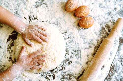 Preview: Small hands kneading dough. Little child preparing dough for backing. Kid's hands, some flour.