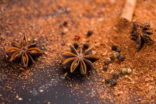 Preview: Close-up of star anise and cinnamon and ground pepper lie on the table. Spicy food concept and