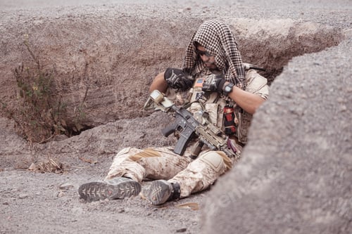 Preview: Soldiers in camouflage military uniforms carrying weapons Reconnaissance missions in rugged mountain