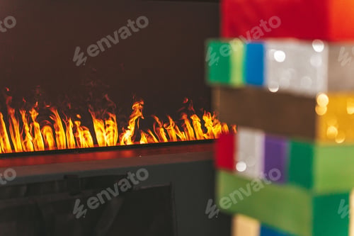 Preview: a fireplace behind blurry stacked colorful bricks