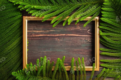 Preview: Christmas golden picture frame with pine leaf and bauble decor on wood table