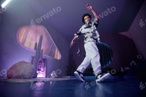 Preview: Cool Young Man Dancing Hip-Hop in Dimly Lit Studio