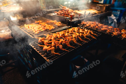 Preview: Barbecue skewers on a street side grill