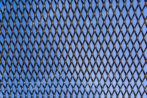 Preview: Wire grid fence background on blue sky background