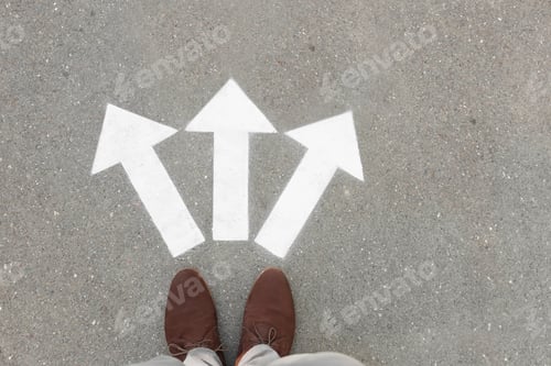 Preview: Man standing near arrows on asphalt, top view. Choice concept