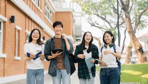 Preview: Young Asian college students and a female student group work at the campus park