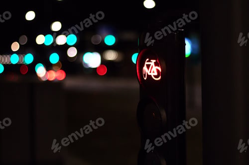 Preview: Closeup shot of a bicycle sign on a street at night
