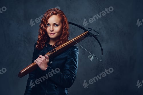 Preview: Redhead female holds crossbow.