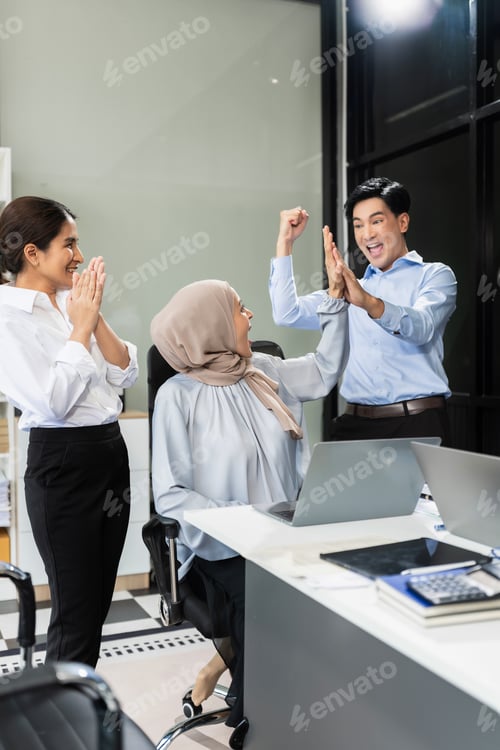Preview: teammates involved in dialogue in conference room.