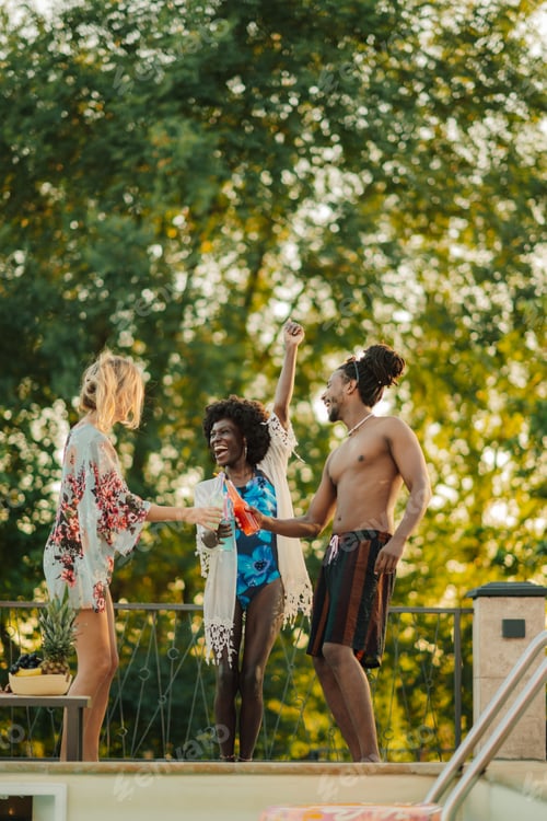 Preview: Friends toasting drinks at a pool party