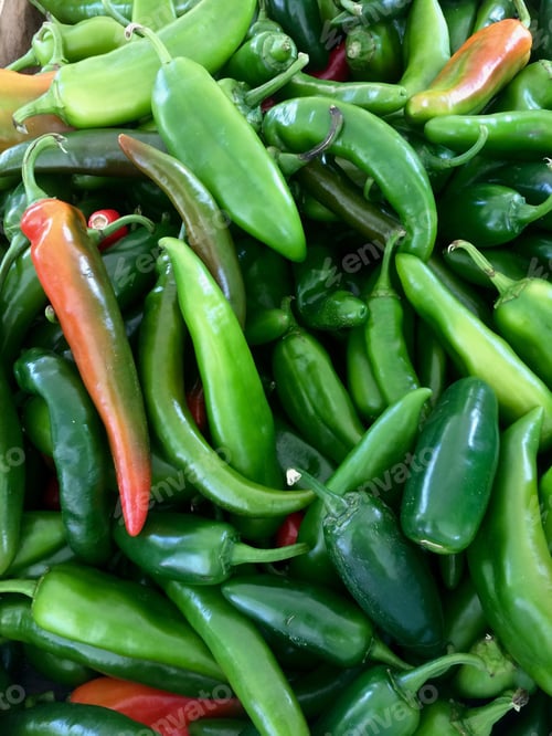 Preview: Green jalapeño peppers from above. Background with copy space. Screensaver. Wallpaper.