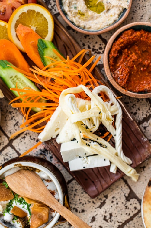 Preview: Cheese with herbs and vegetables served in Turkish Village Breakfast. Top view