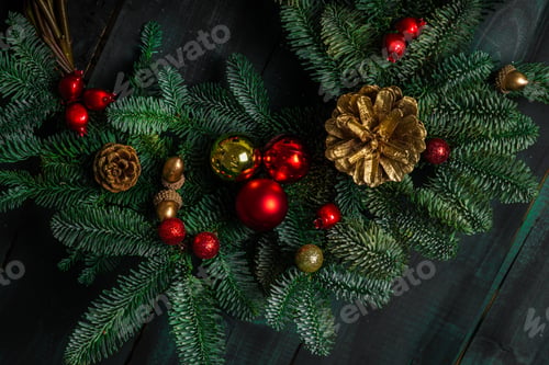 Preview: New Year's wreath made of nobilis, decorated with balls and toys in a low key with festive mood