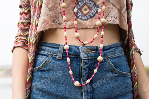 Preview: young girl in denim shorts, jewelry accessories.