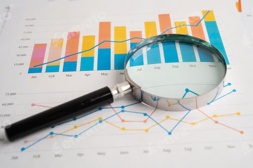 Preview: Magnifying glass on spreadsheet and graph paper. Financial development, Banking Account,