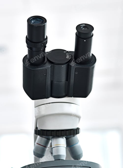 Preview: Still life shot of a microscope placed in a laboratory with its eyepiece facing upwards