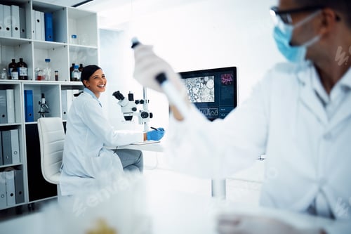 Preview: Shot of two young scientists having a discussion while conducting medical research in a laboratory
