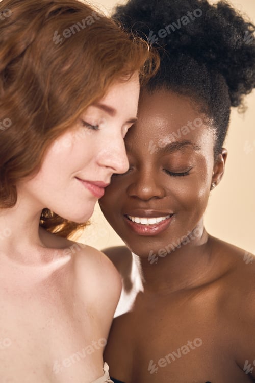 Preview: Two Diverse Women with Eyes Closed and Smiling