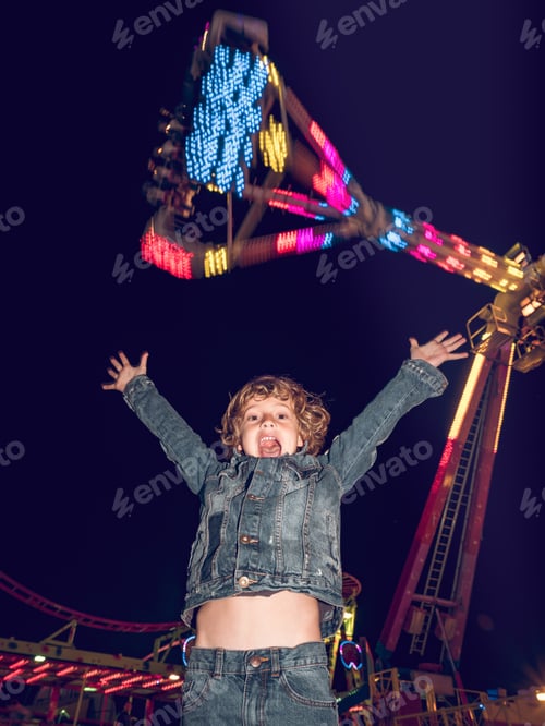 Preview: Excited little boy on funfair