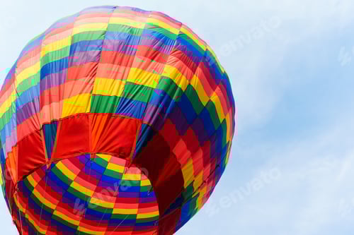 Preview: Colorful hot air balloon floating against blue sky
