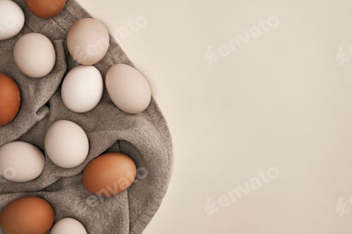 Preview: Directly above shot of natural eggs on the natural textile