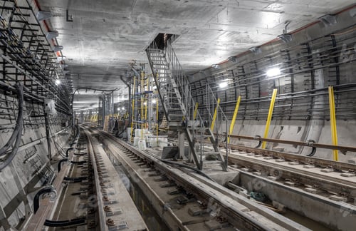Preview: Iron staircase in the middle of the subway tunnel leading to the technical room