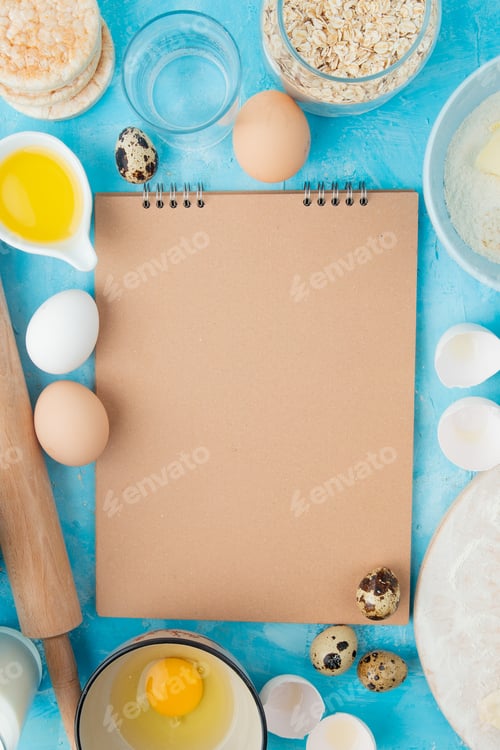 Preview: top view of foods as egg, butter, oat-flakes with water on blue background with copy space