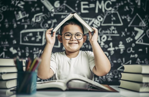 Preview: A boy with glasses studied and put a book on his head in the classroom.