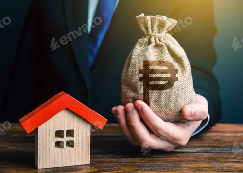 Preview: Man holds out a philippine peso bag near the house.