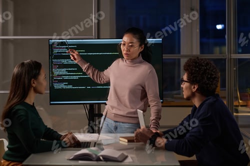 Preview: Asian IT Specialist Speaking About Computer Code