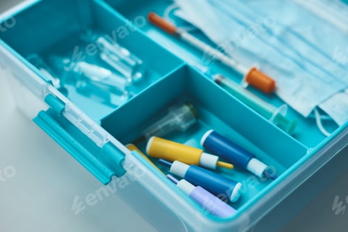 Preview: First aid kit close up. Home medicine box with a medical items. Healthcare and medicine concept