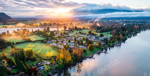 Preview: Scenic Aerial View of Mission, BC at Sunrise With Flowing River and Lush Green Landscape