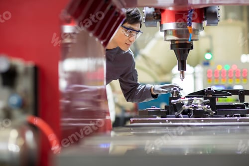 Preview: Young engineer working in the factory