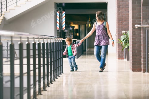 Preview: Mum and the son walking in the shopping center