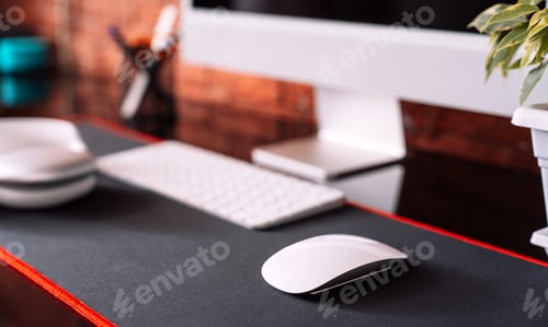 Preview: Cozy workplace with computer and wireless devices and home plant