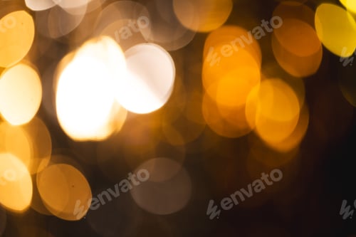 Preview: Yellow bokeh lights with copy space on dark background