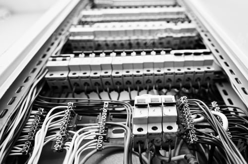 Preview: Close up view of electrical panel with fuses and contactors.