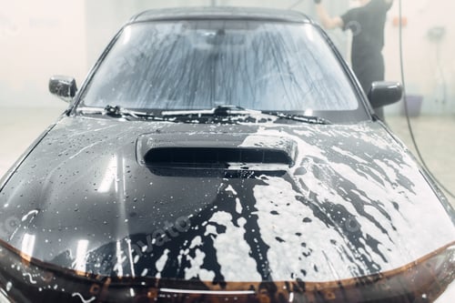 Preview: Carwash service, worker washing foam off