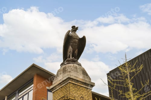 Preview: a statue of a bird on top of a building