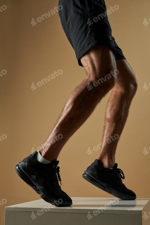 Preview: Athlete male jumping up isolated on yellow background
