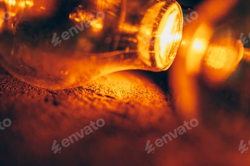 Preview: Garland of light bulbs close up in the dark
