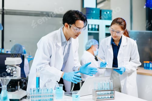 Preview: Scientists collaborating in a modern biotechnology lab with microscopes and test tubes,