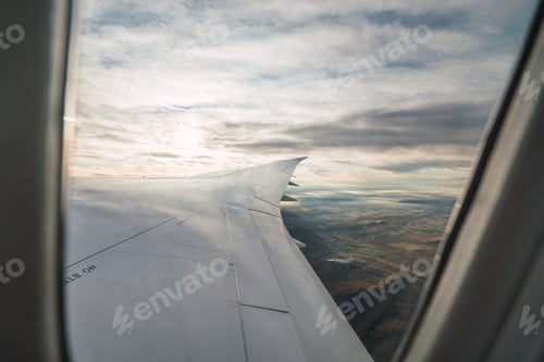 Preview: Bearded passenger using device in aircraft