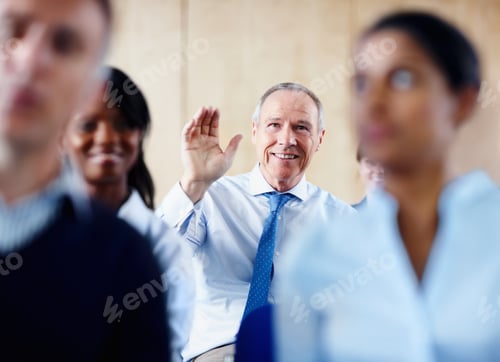 Preview: Senior executive raising his hand