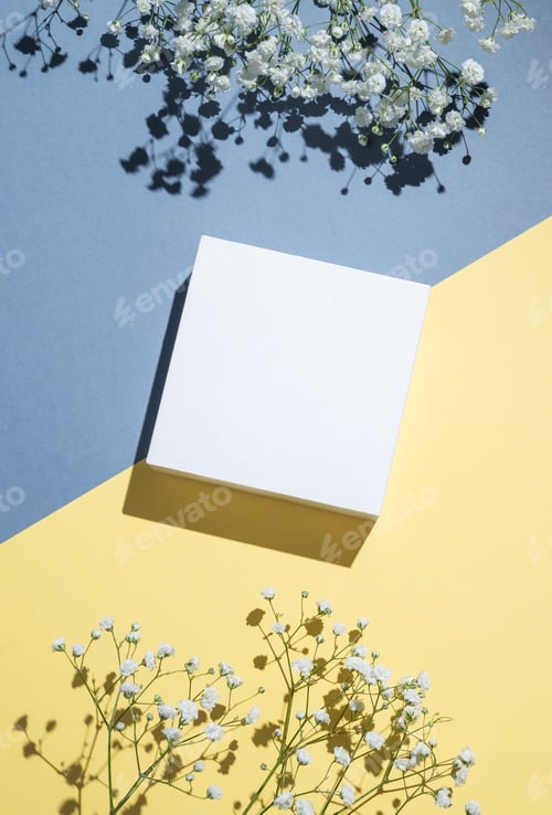 Preview: White cube, podium or box with shadow on diagonally divided yellow and blue background